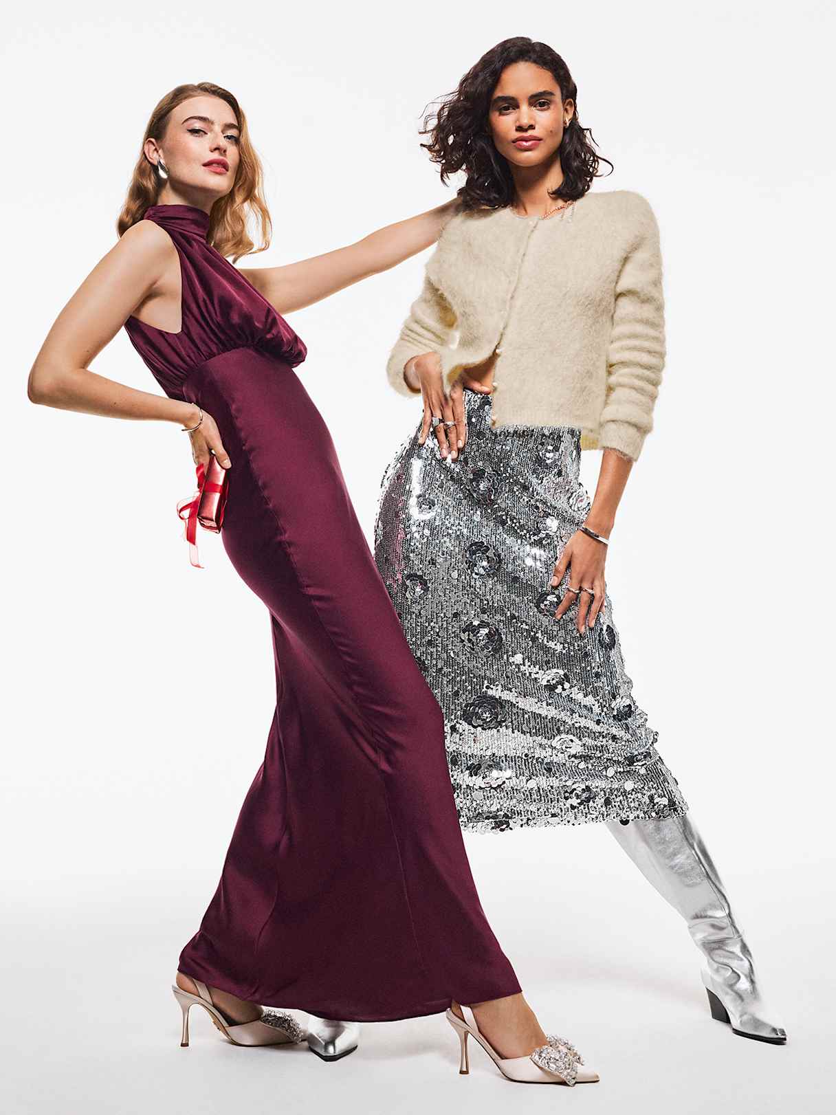 Two models with long burgundy dress and a silver sequin skirt